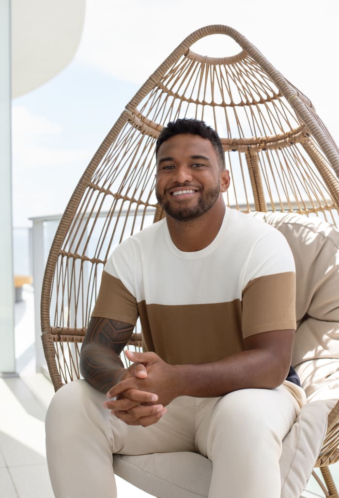 Tua Tagovailoa models brown and white Perry Ellis clothing.